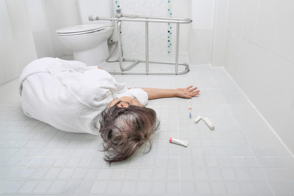 Caregiver assisting elderly resident with mobility and fall prevention in nursing home by Nursing Home Injury Law Group in Las Vegas Nevada